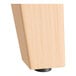 A Lancaster Table & Seating solid wood live edge table leg with a white background.