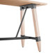 A Lancaster Table & Seating live edge solid wood bar height table with metal legs.