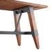 A Lancaster Table & Seating solid wood dining table with metal legs.