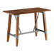 A Lancaster Table & Seating bar height table with a wooden live edge top and metal trestle base.