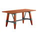 A Lancaster Table & Seating wooden table with a live edge top and trestle base.