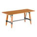 A Lancaster Table & Seating wooden table with metal trestle legs.