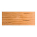 A rectangular solid wood table top with a honey maple finish and live edge design.