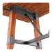 A Lancaster Table & Seating wooden table with metal trestle legs.