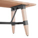 a wooden table with black legs