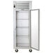 A white Traulsen G Series reach-in refrigerator with a right-hinged glass door open.