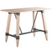 A Lancaster Table & Seating solid wood table with legs.