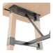 A Lancaster Table & Seating solid wood bar height table with metal trestle legs.