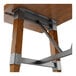 A Lancaster Table & Seating live edge bar height table with a metal trestle base.