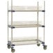 A white MetroMax 4 metal rack with three white metal shelves.