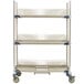 A white metal MetroMax i three tier tray drying rack with shelves.