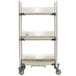 A white MetroMax metal three tier tray drying rack with wheels.