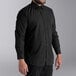 A man wearing a Henry Segal black dress shirt.