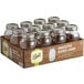 A case of 12 Ball smooth sided glass jars with silver metal lids.