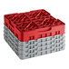 A red plastic Cambro glass rack with grey extenders.