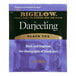 A purple Bigelow Darjeeling tea bag with white text.