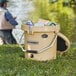 A man fishing in a CaterGator outdoor cooler.