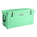A seafoam green cooler with black handles.