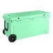 A seafoam green CaterGator outdoor cooler with black wheels.