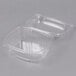 A clear plastic Genpak deli container with a high dome lid.