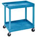 A blue Luxor plastic utility cart with wheels.