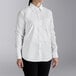 A woman wearing a Henry Segal white long sleeve dress shirt.