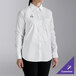 A woman wearing a white Henry Segal long sleeve dress shirt.