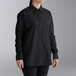 A woman wearing a black Henry Segal long sleeve dress shirt.