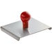 A red rubber ball on a metal plate with a red Prince Castle logo.