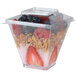 A Fineline plastic lid on a container of fruit