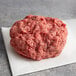 Warrington Farm Meats frozen ground round beef on white paper