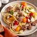 A plate of spaghetti with Warrington Farm Meats ground beef and tomatoes.