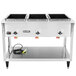 A large stainless steel Vollrath electric hot food table with three sealed wells.