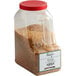 A plastic container of brown Regal Honey Sweet Herb Blend.