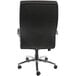 A black Boss Caressoft office chair with chrome wheels.