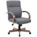 a grey office chair with wooden arms