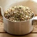A metal pot filled with Regal Savory Grill Seasoning.