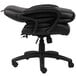 A Boss black leather office chair with wheels.