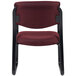 A burgundy Boss guest chair with black frame and back.