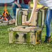 A person putting food in a CaterGator camouflage cooler.