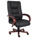 A black office chair with wooden arms.