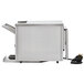 A Vollrath convertible conveyor toaster machine with a plug.