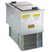 A Delfield drop-in freezer with stainless steel lids.