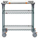 A Metro PrepMate MultiStation cart with MetroSeal wire shelving and wheels.