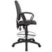 A Boss black leather drafting stool with a black seat and back.