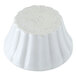 A white circular Hall China ramekin with writing on it.
