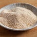 A bowl of Regal Sweet Meat Rib Rub on a wooden table.