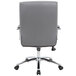 The back of a Boss gray office chair with wheels.