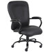 A black Boss office chair with armrests and wheels.