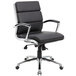 a black office chair with chrome legs